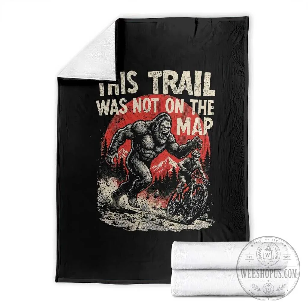 Funny Bigfoot Chasing Mountain Biker Throw Blanket